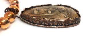 the jasper is set in a bezel with a cactus motif