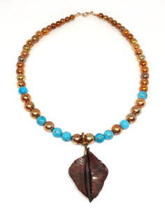 kingman turquoise and flame painted copper bead necklace with fold formed copper leaf