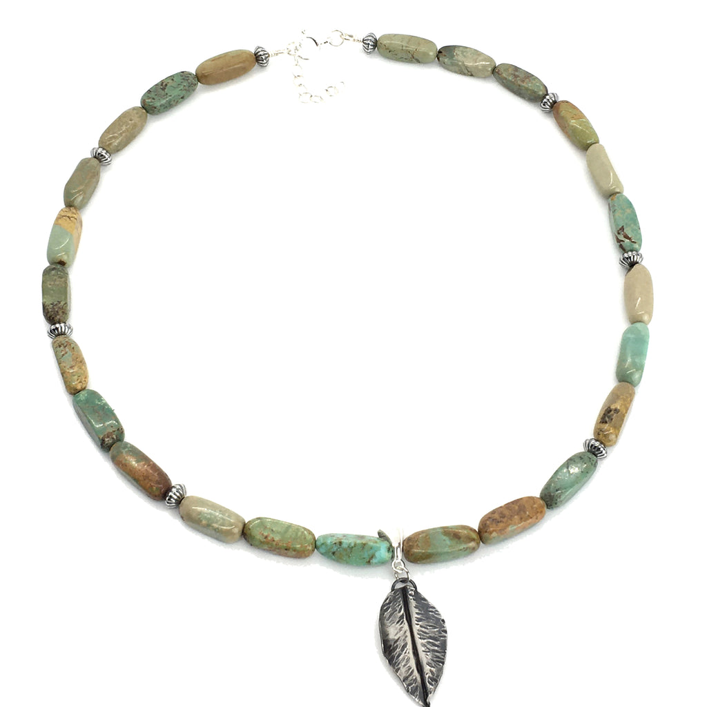 Green turquoise beaded necklace with sterling silver southwestern beads and a hand forged sterling silver leaf